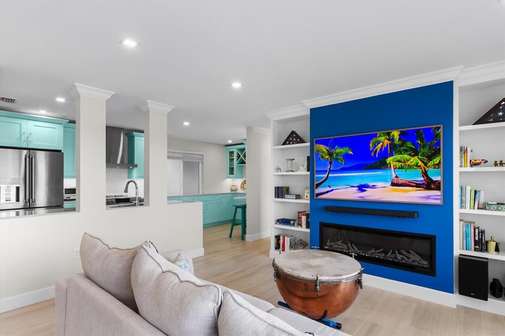 174 Golden Gate Point, Unit 32 Sarasota, FL 34236 - Photo 13 of 46 a living room with furniture and a fireplace