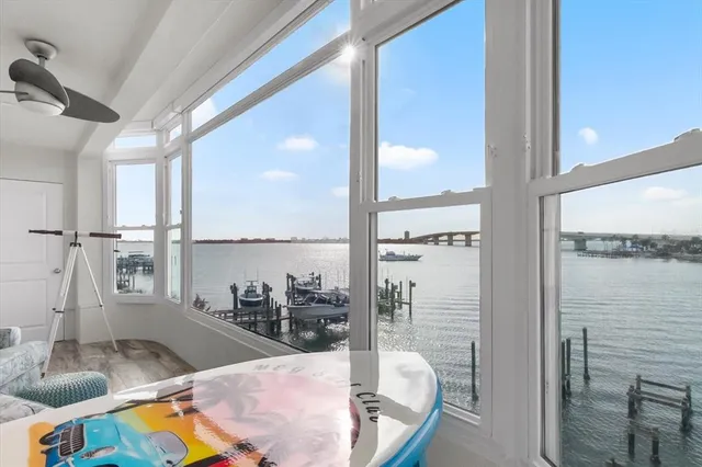 a kitchen with a sink and view of living room