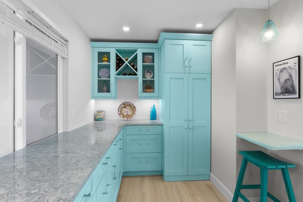 174 Golden Gate Point, Unit 32 Sarasota, FL 34236 - Photo 22 of 46 a view of a hallway with wooden floor and windows