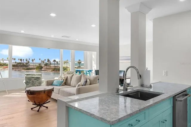 a living room with kitchen island furniture and a sink