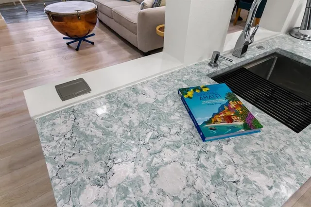 a room with pool table and couch