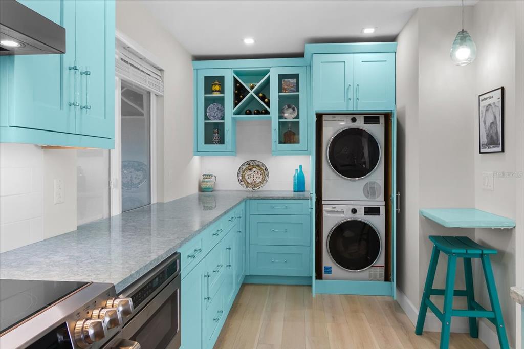 174 Golden Gate Point, Unit 32 Sarasota, FL 34236 - Photo 29 of 46 a view of kitchen with washer and dryer