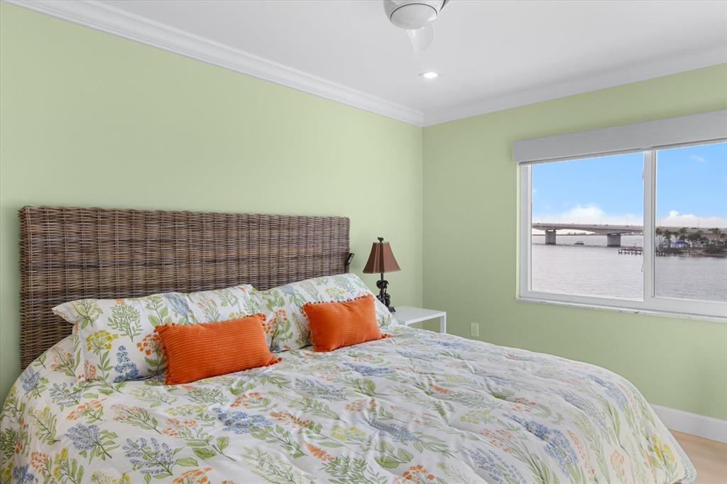174 Golden Gate Point, Unit 32 Sarasota, FL 34236 - Photo 30 of 46 a bedroom with a bed and window