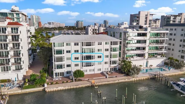 a large building with a lot of trees in front of it