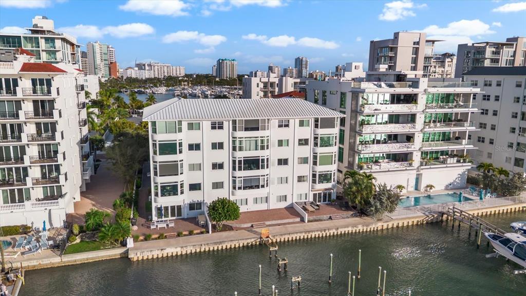 174 Golden Gate Point, Unit 32 Sarasota, FL 34236 - Photo 41 of 46 a large building with a lot of trees in front of it