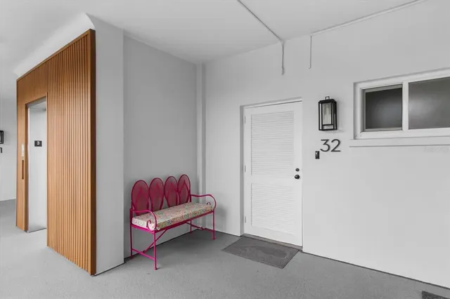 a living room with a couch and dresser