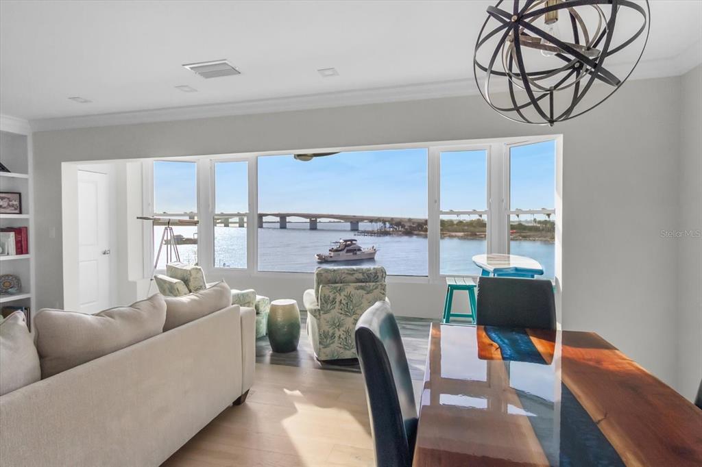 174 Golden Gate Point, Unit 32 Sarasota, FL 34236 - Photo 6 of 46 a living room with furniture and a fireplace