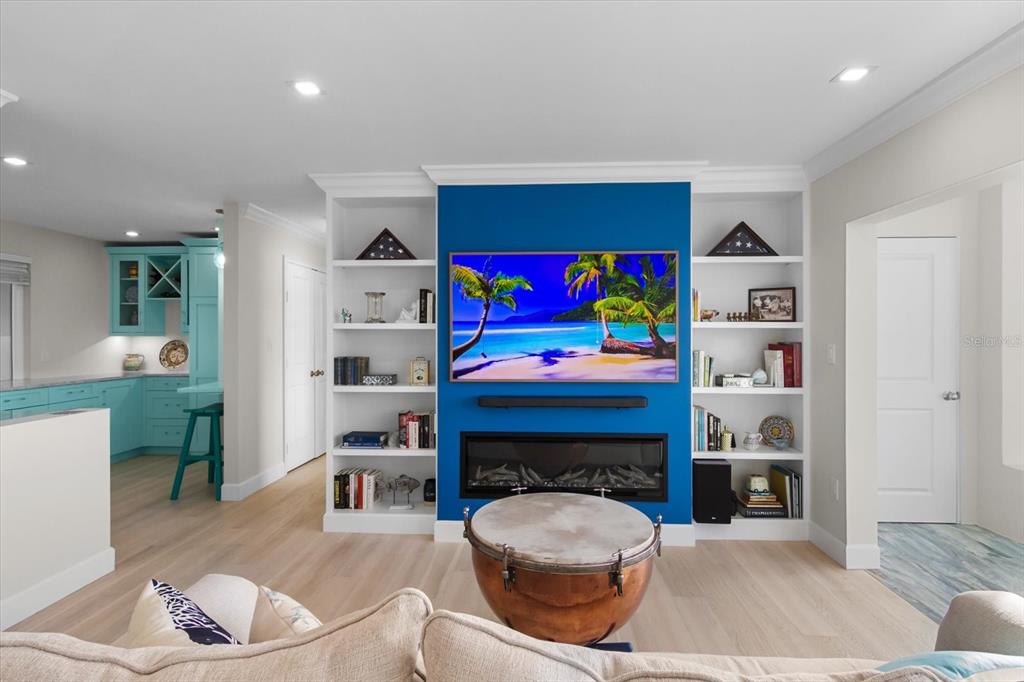 174 Golden Gate Point, Unit 32 Sarasota, FL 34236 - Photo 10 of 46 a living room with furniture and a fireplace