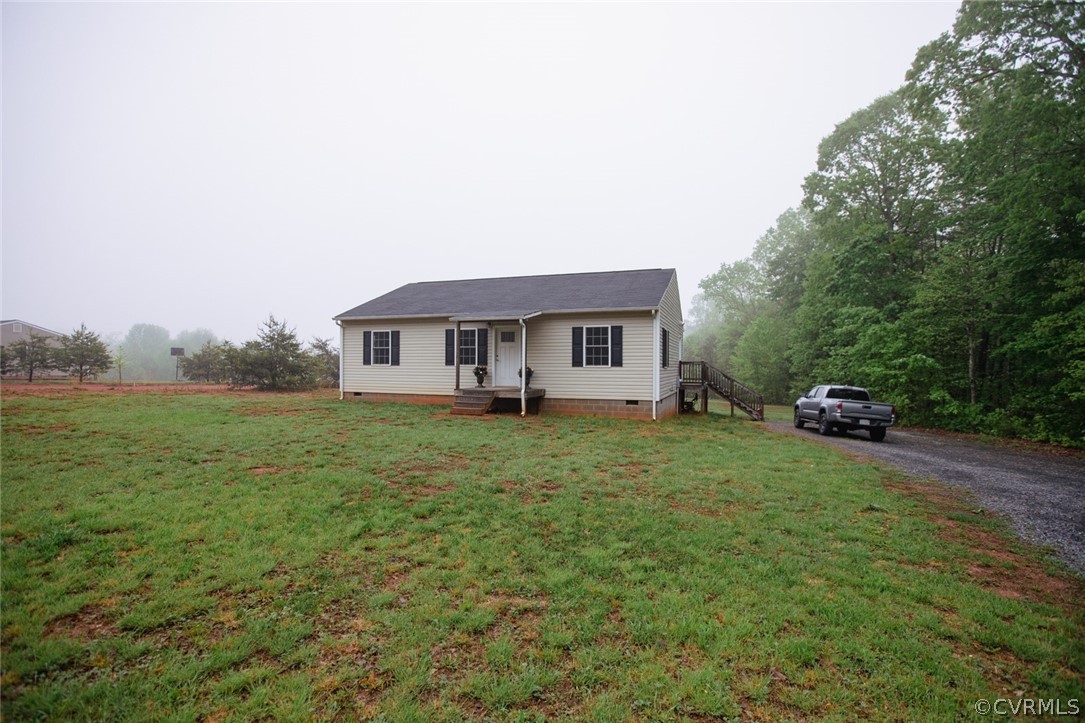 758 Troublesome Creek Road Buckingham, VA 23921 - Photo 3 of 48 a house view with a garden space