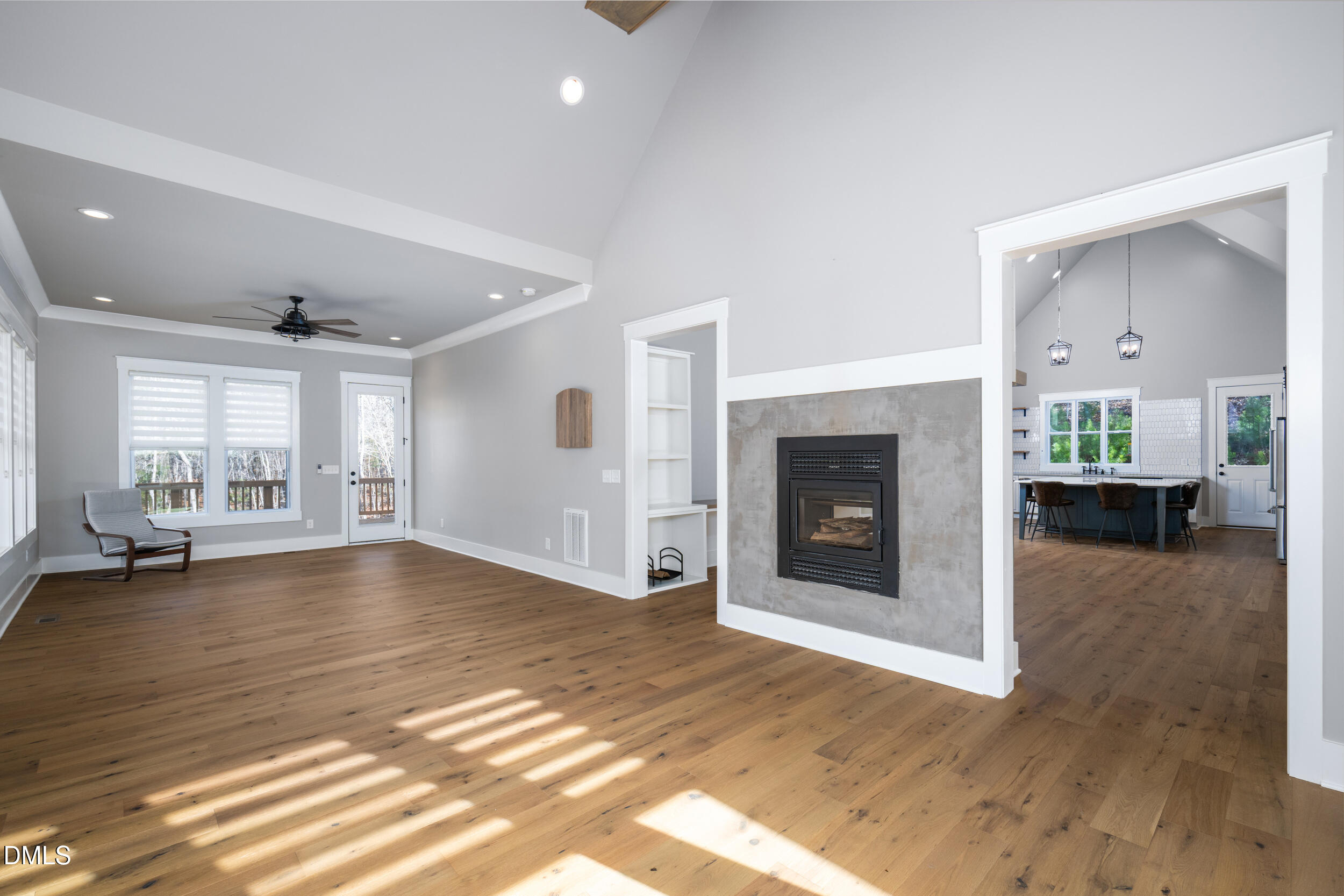 343 Deer Mountain Road Pittsboro, NC 27312 - Photo 14 of 55 a view of empty room with wooden floor and fireplace