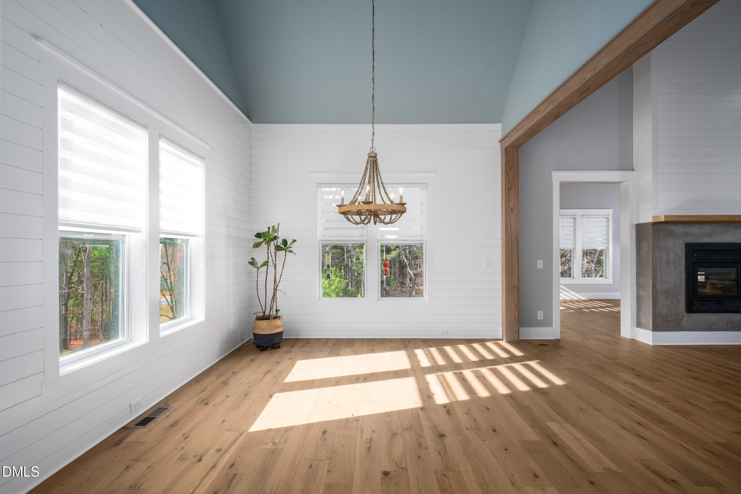 343 Deer Mountain Road Pittsboro, NC 27312 - Photo 19 of 55 a view of an empty room with wooden floor and a window