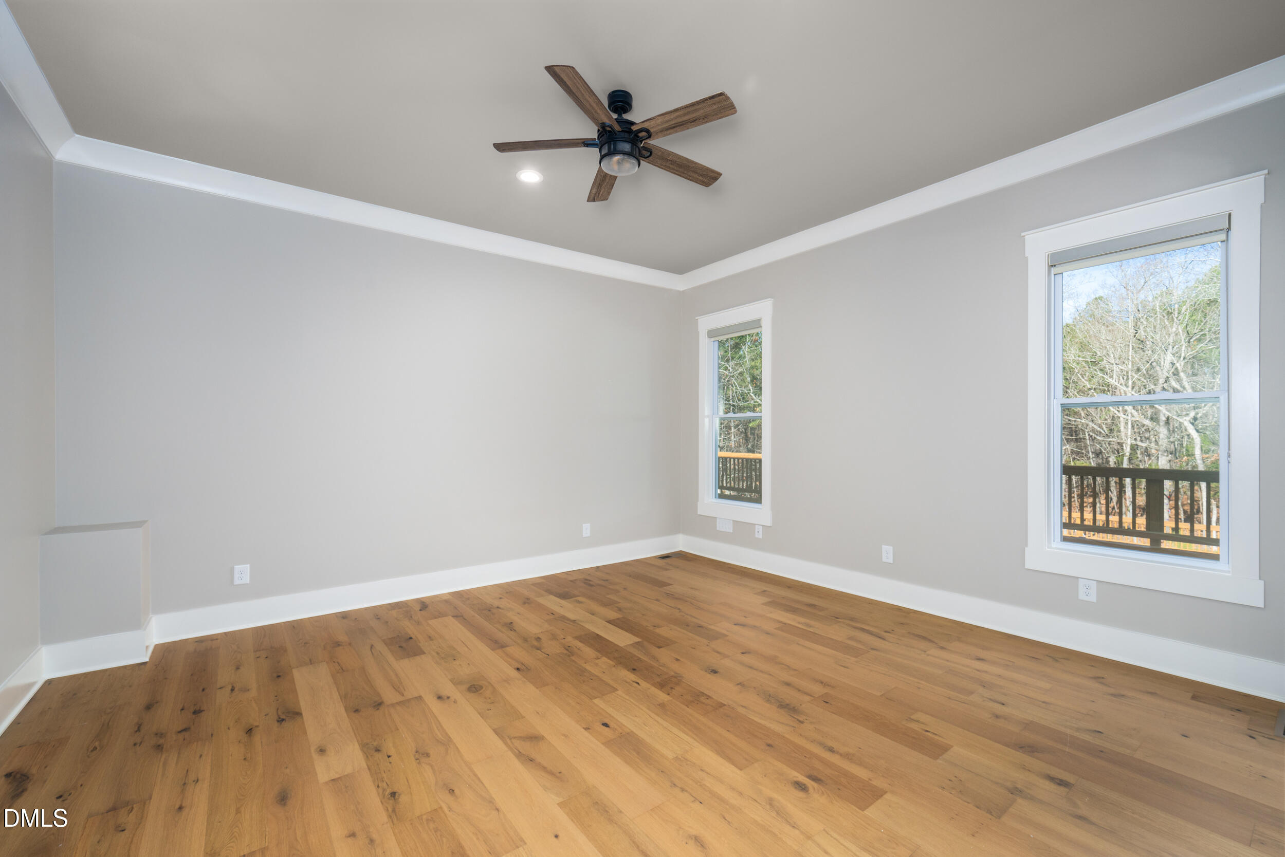 343 Deer Mountain Road Pittsboro, NC 27312 - Photo 23 of 55 wooden floor in an empty room with a window