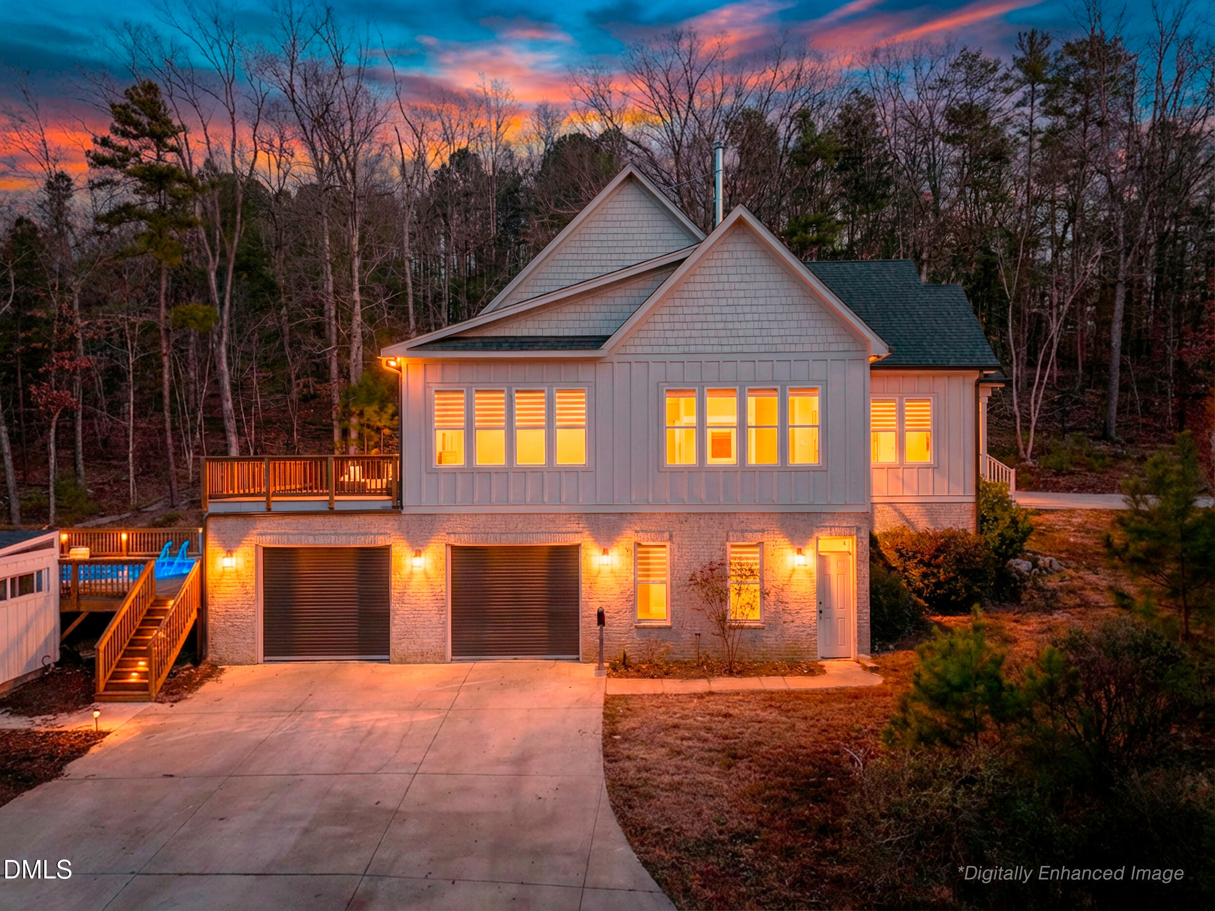 343 Deer Mountain Road Pittsboro, NC 27312 - Photo 3 of 55 a view of swimming pool next to a brick house with large trees