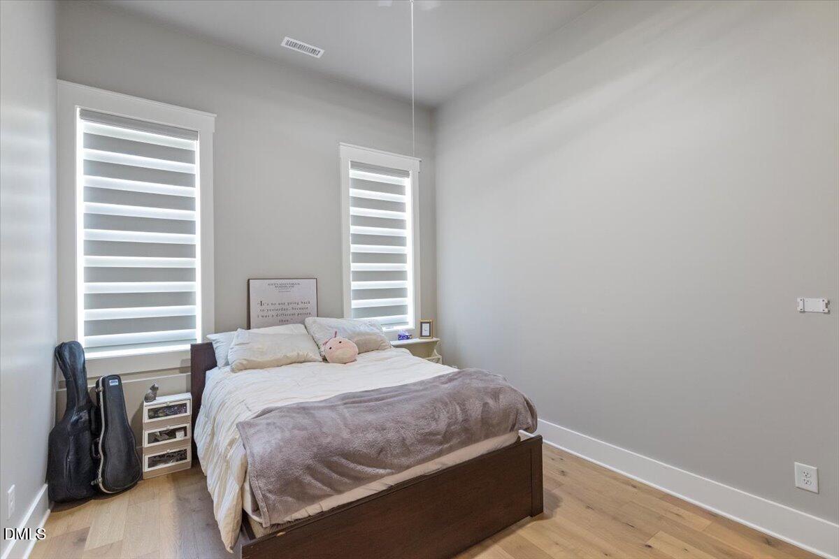 343 Deer Mountain Road Pittsboro, NC 27312 - Photo 36 of 55 a bedroom with a bed and a window