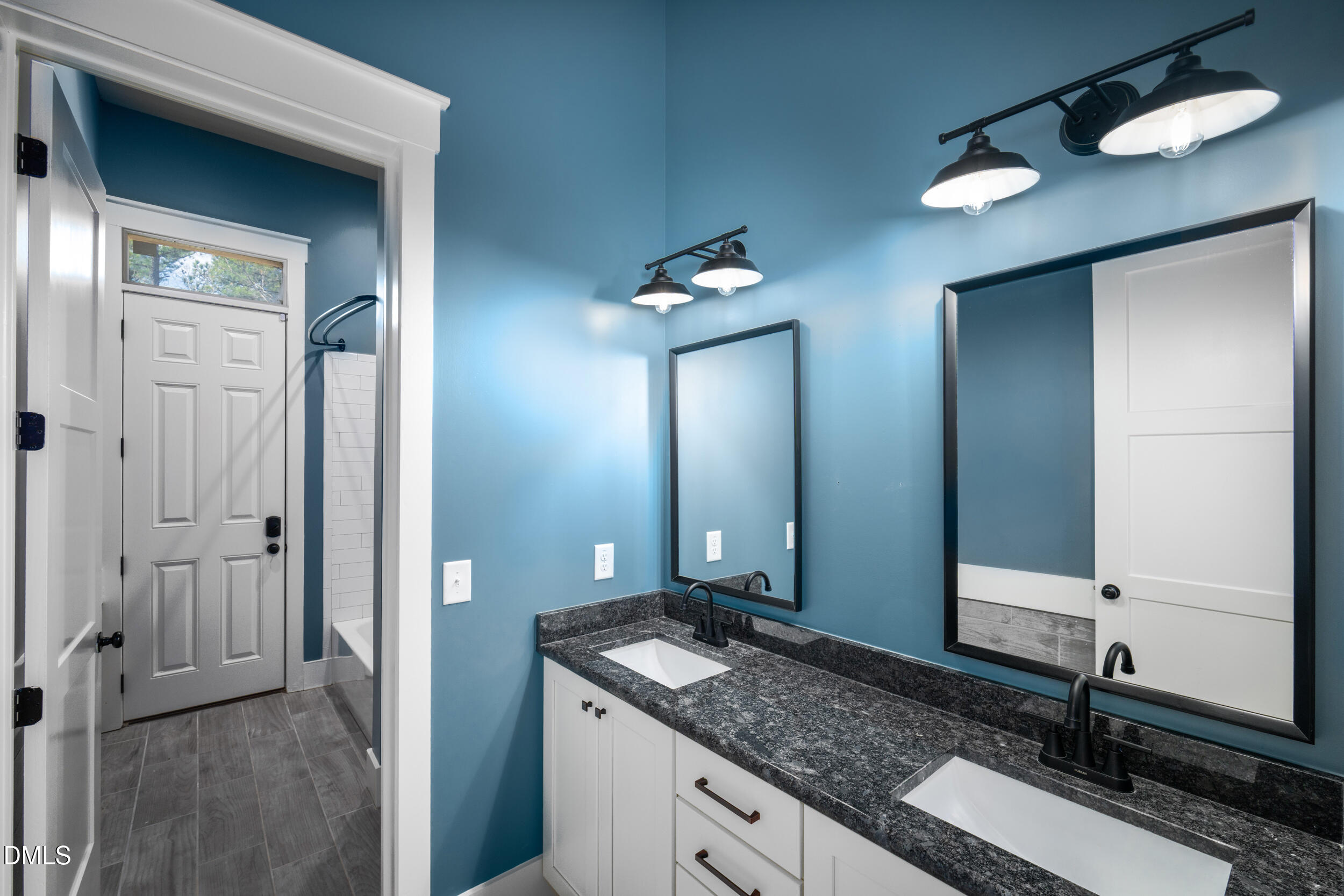 343 Deer Mountain Road Pittsboro, NC 27312 - Photo 37 of 55 a bathroom with a granite countertop sink and a mirror