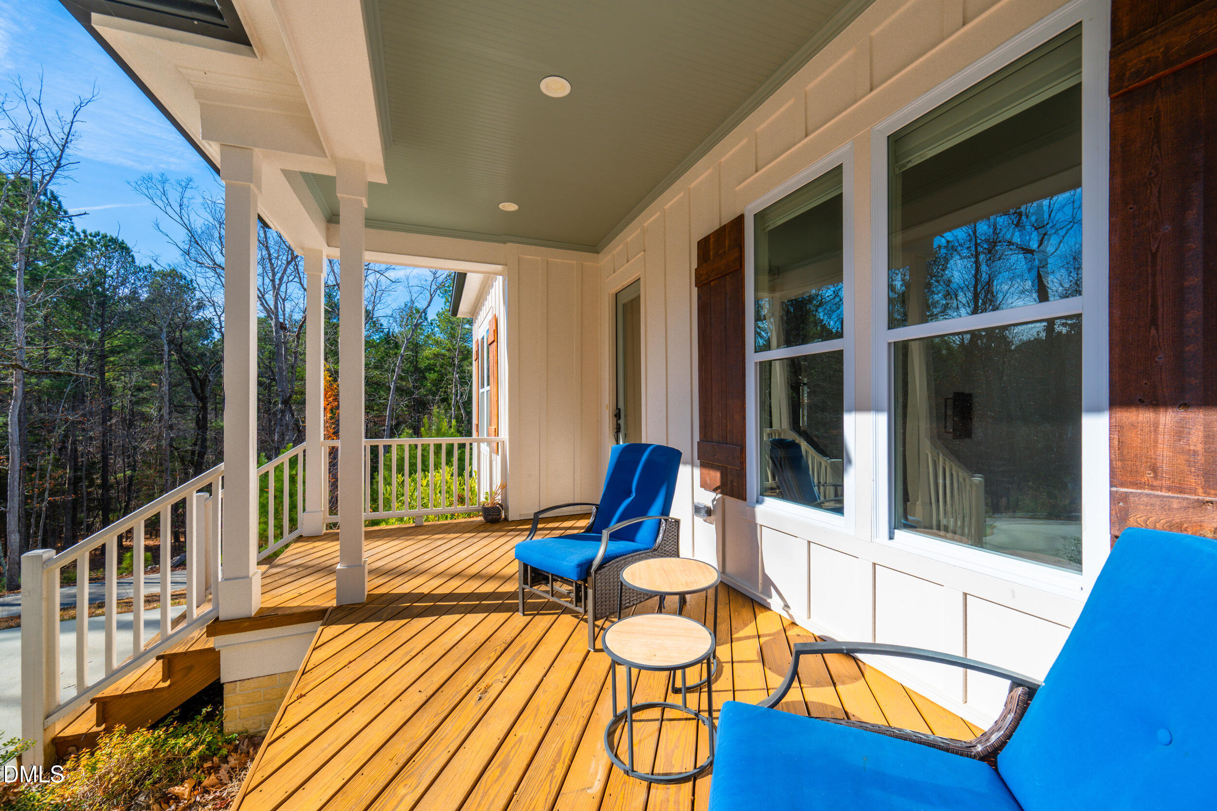 343 Deer Mountain Road Pittsboro, NC 27312 - Photo 4 of 55 a swimming pool with outdoor seating and wooden floor
