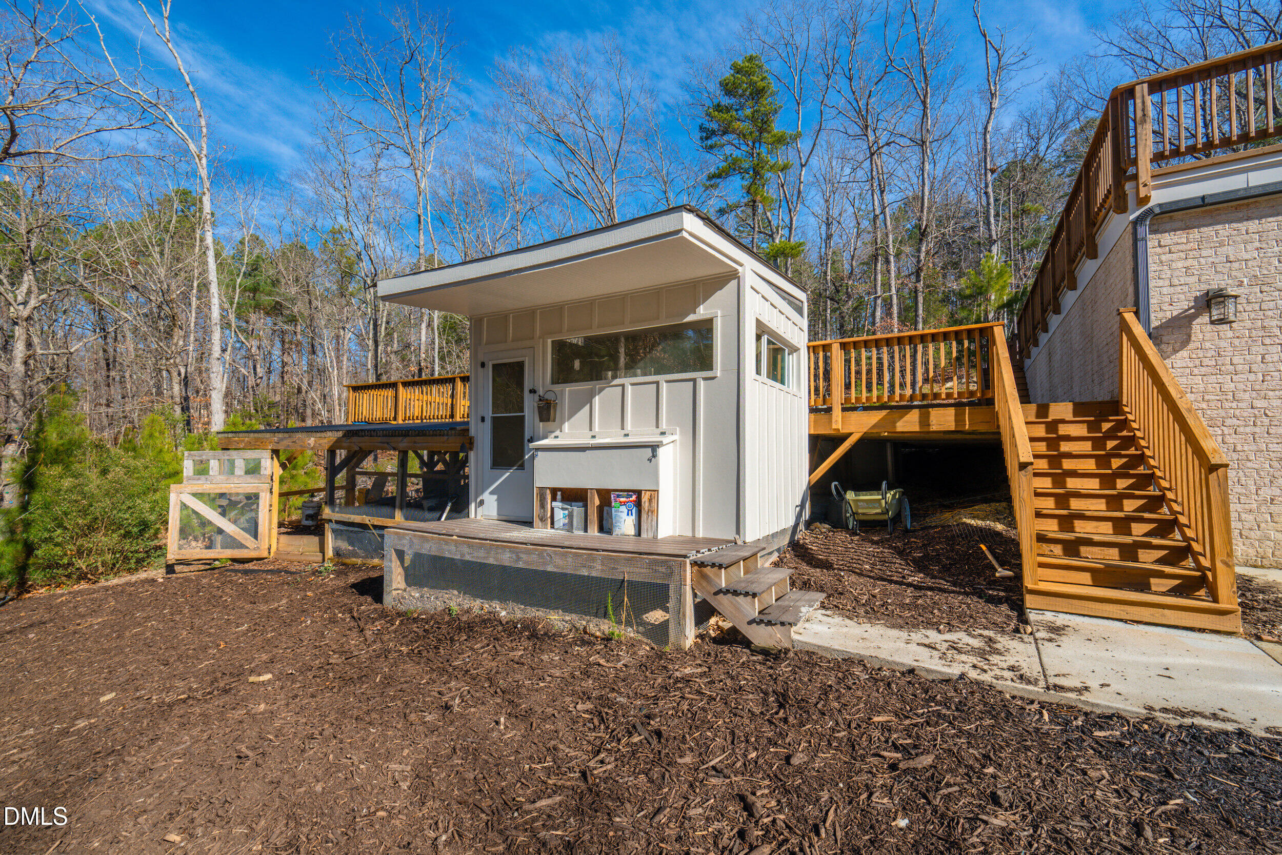 343 Deer Mountain Road Pittsboro, NC 27312 - Photo 50 of 55 a view of house with a large window and wooden fence