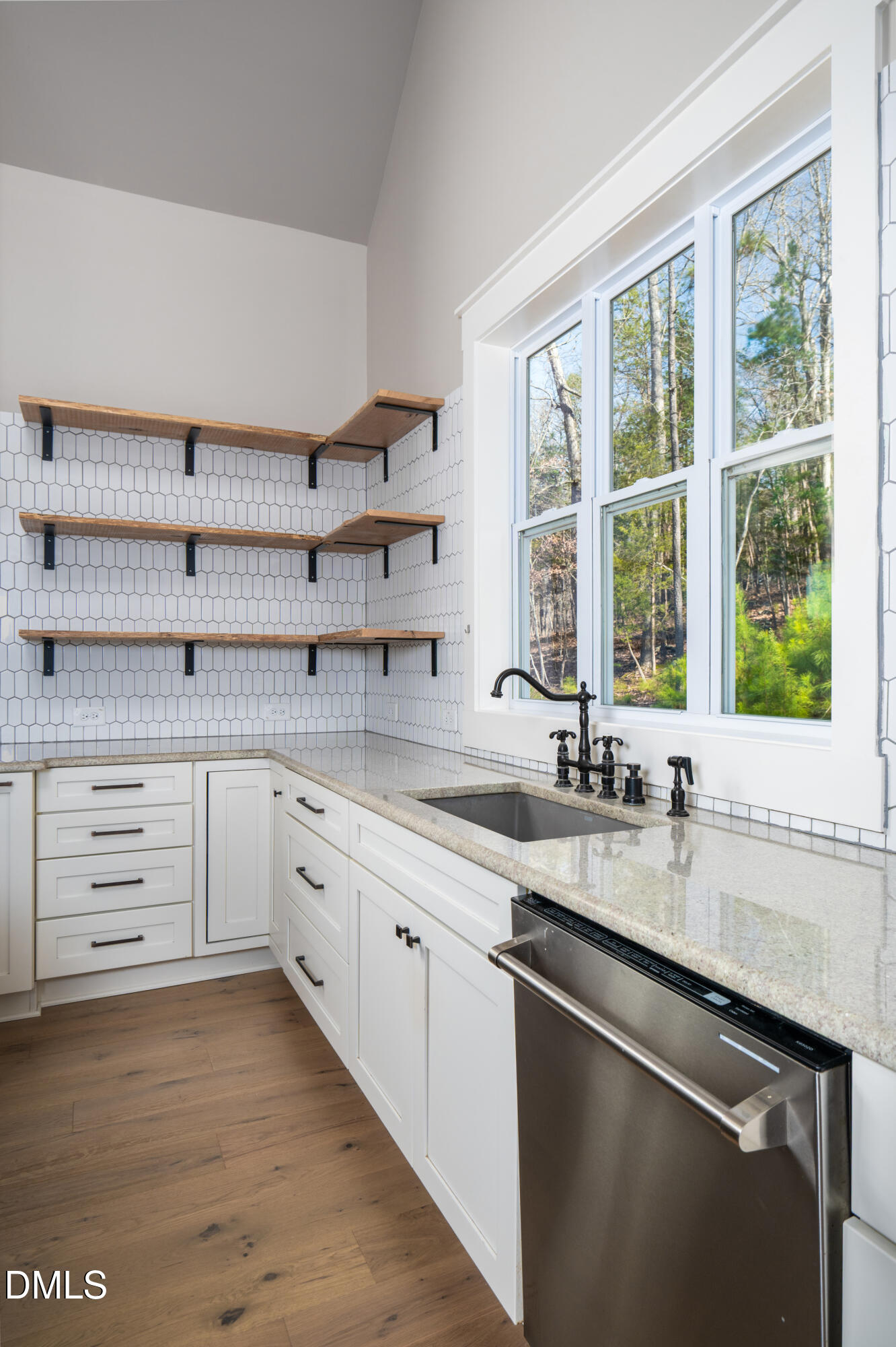 343 Deer Mountain Road Pittsboro, NC 27312 - Photo 8 of 55 a kitchen with a sink stove and cabinets