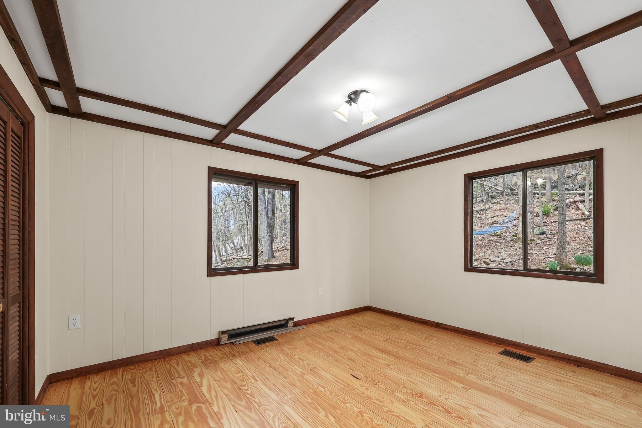 758 Club House Road Front Royal, VA 22630 - Photo 13 of 50 a view of an empty room with a window