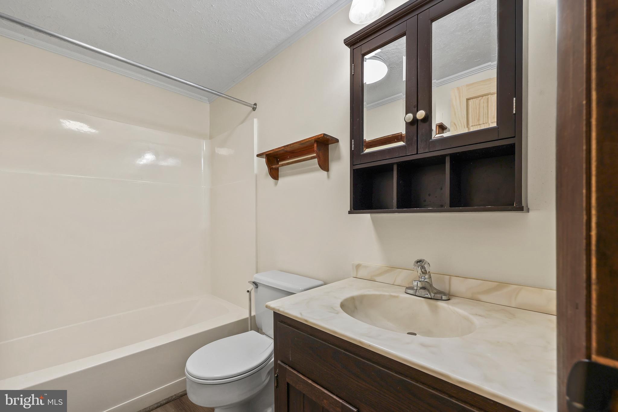 758 Club House Road Front Royal, VA 22630 - Photo 15 of 50 a bathroom with a granite countertop toilet sink and mirror
