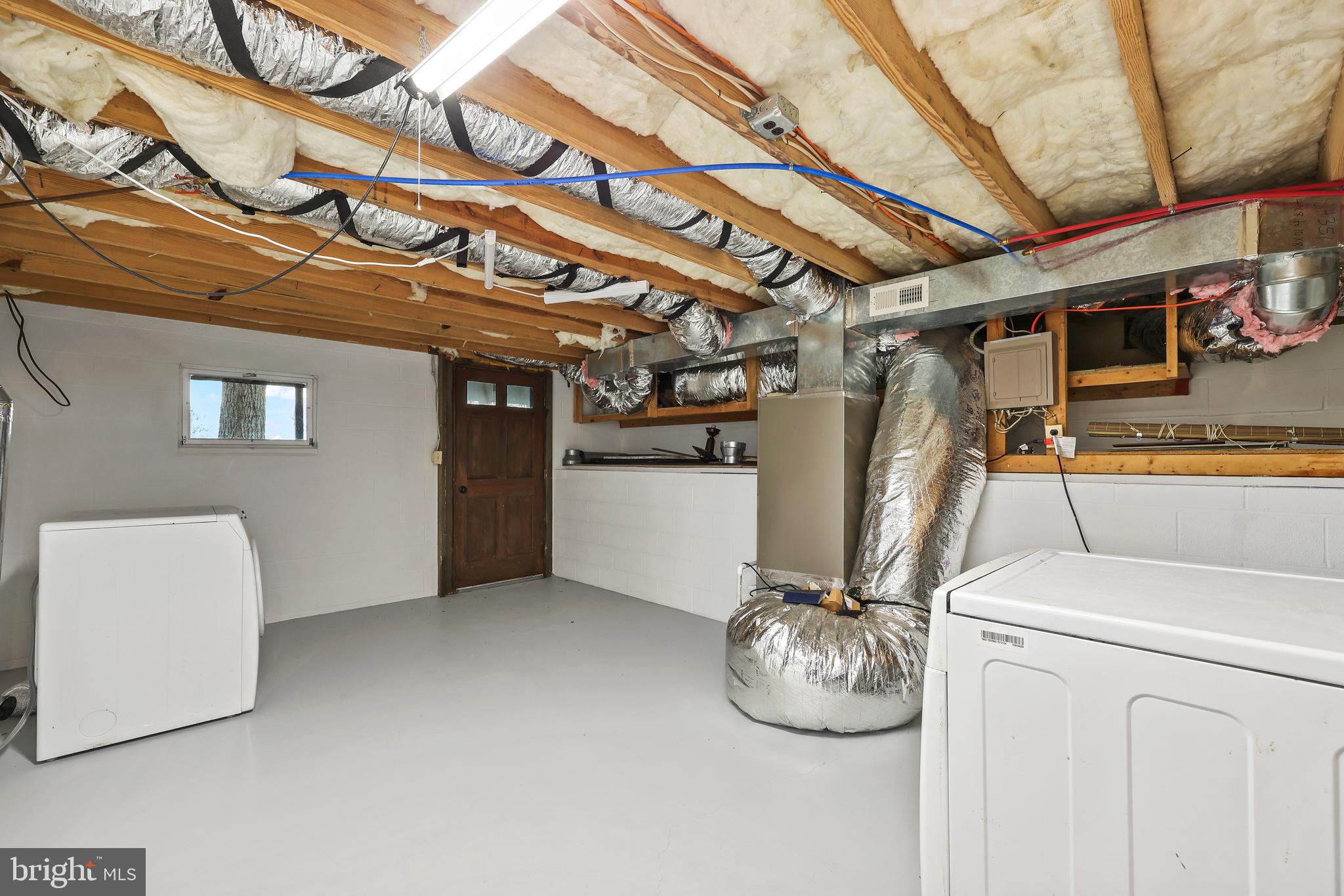 758 Club House Road Front Royal, VA 22630 - Photo 27 of 50 a room with water heater and wooden floor