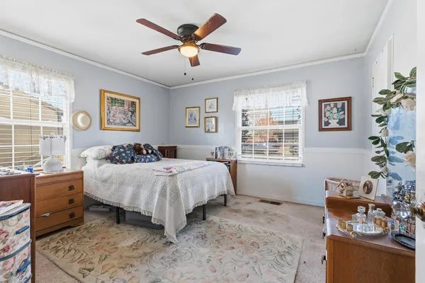 a bed room with a bed and a couch