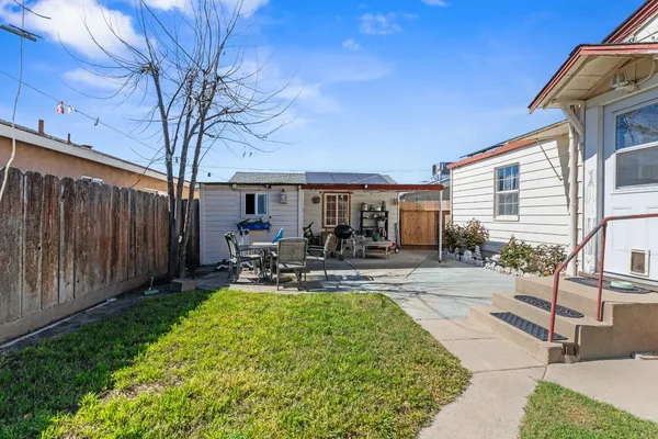 a view of a backyard with sitting area