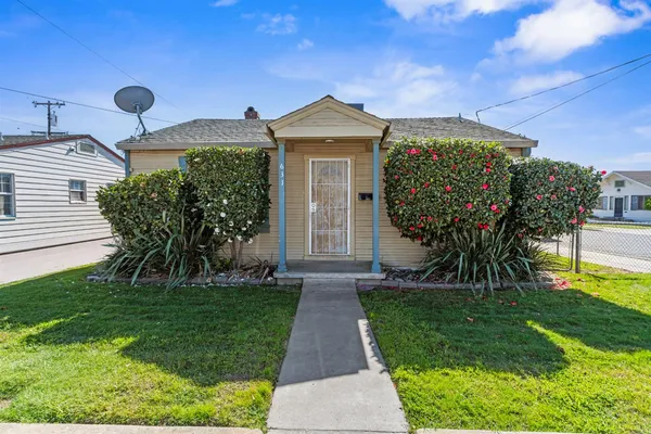 a front view of a house with garden