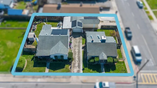 an aerial view of house with swimming pool