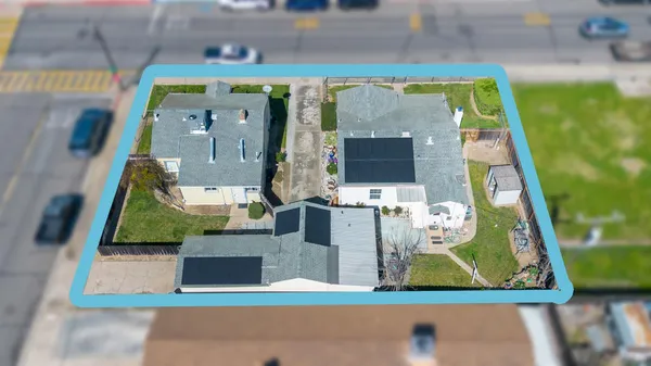 an aerial view of a house with a swimming pool