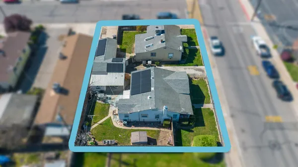 an aerial view of a house with a ocean view