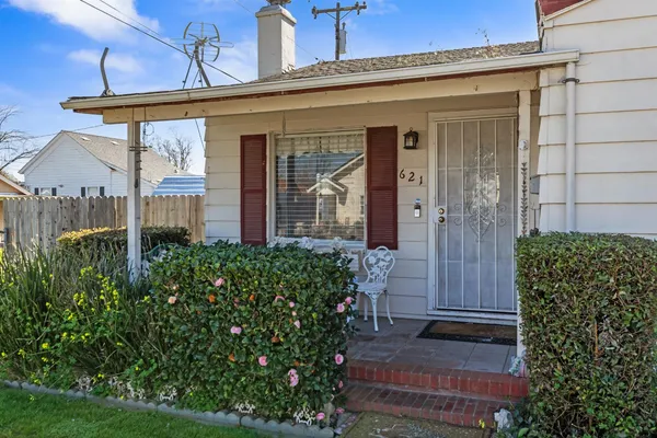 front view of a house with a small yard