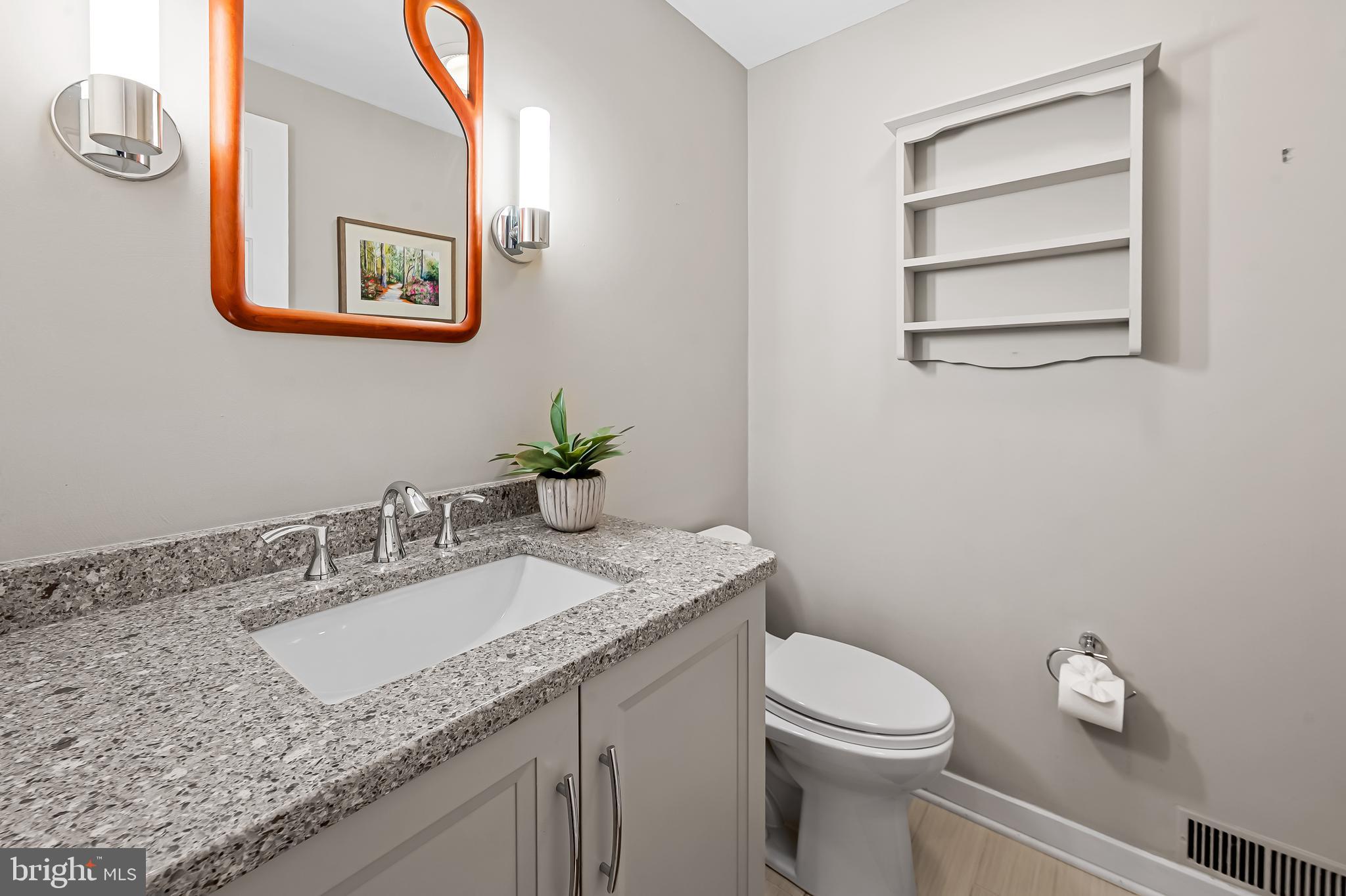 2423 Still Forest Road Pikesville, MD 21208 - Photo 12 of 62 Half bath on main level, off den, tucked away