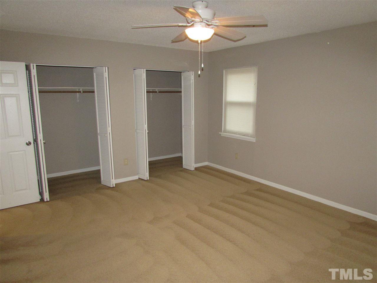 5718 Pool Raleigh, NC 27612 - Photo 14 of 17 an empty room with windows and fan