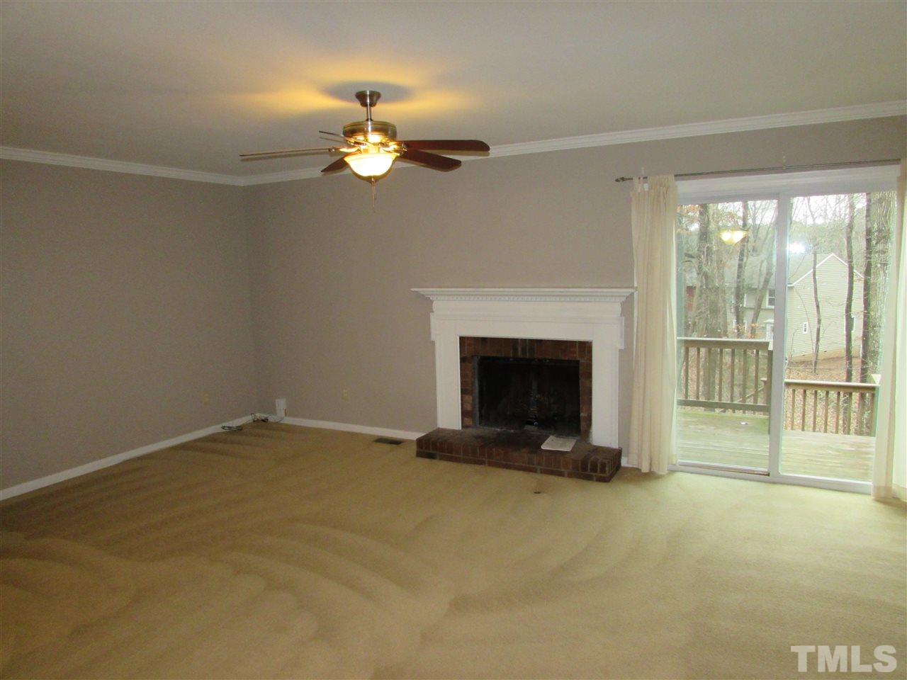 5718 Pool Raleigh, NC 27612 - Photo 8 of 17 a view of an empty room with a fireplace