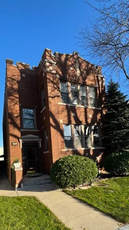 a view of a building with a yard