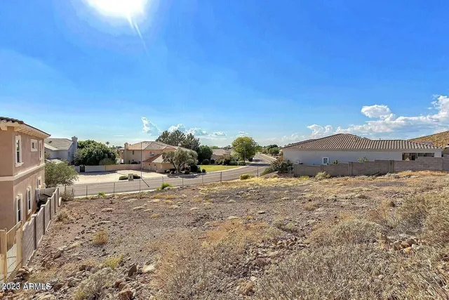 a view of a street with a building in the background