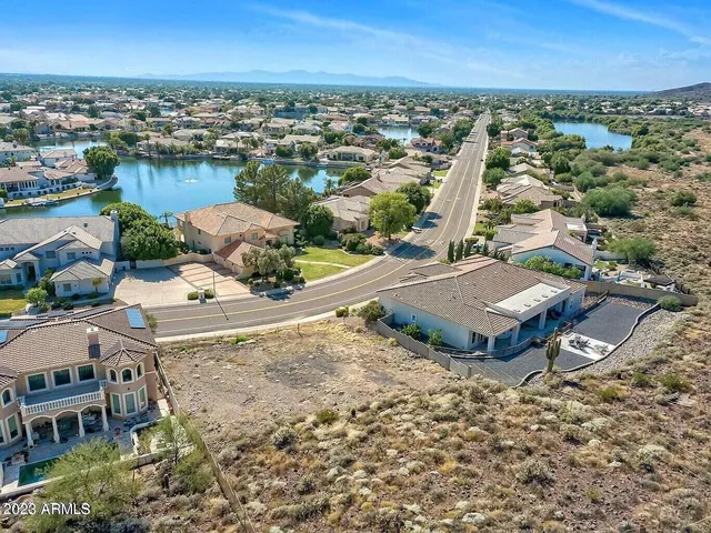 a view of a big house with a big yard