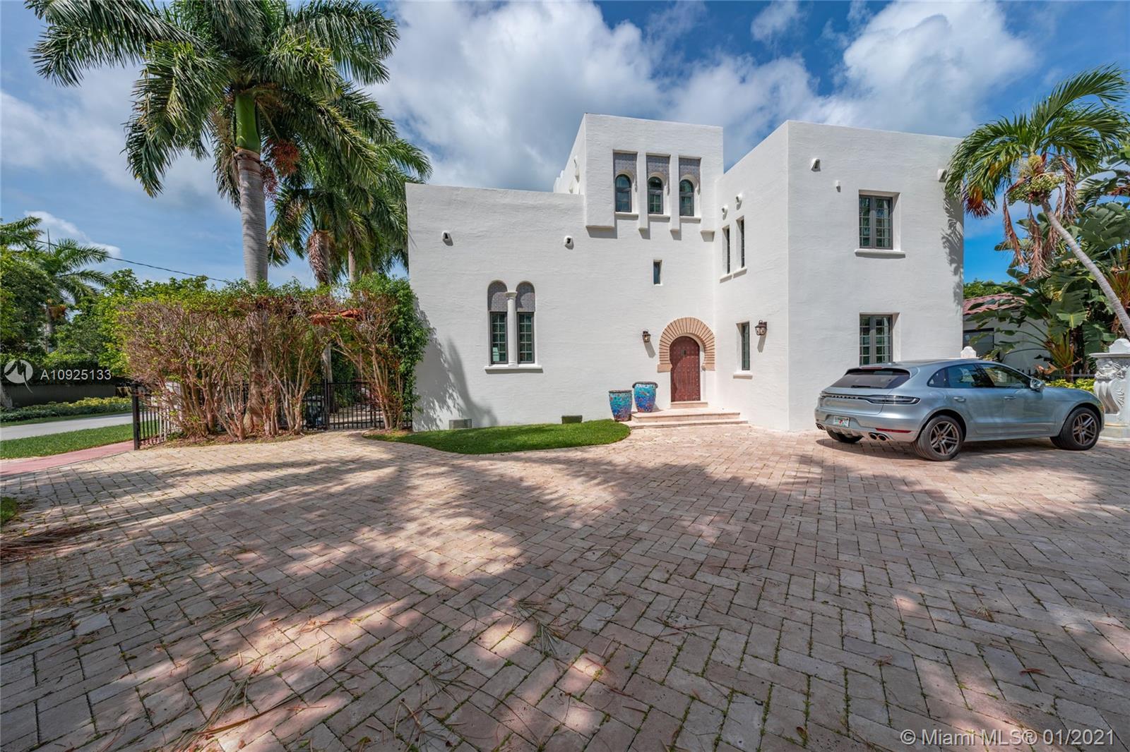 5300 Pine Tree Drive Miami Beach, FL 33140 - Photo 2 of 40 a view of multiple houses with a street