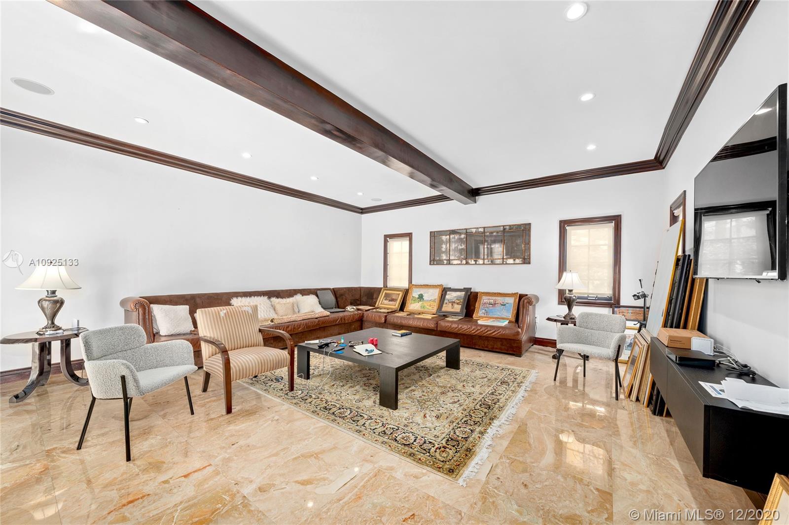 5300 Pine Tree Drive Miami Beach, FL 33140 - Photo 13 of 40 a living room with furniture and wooden floor