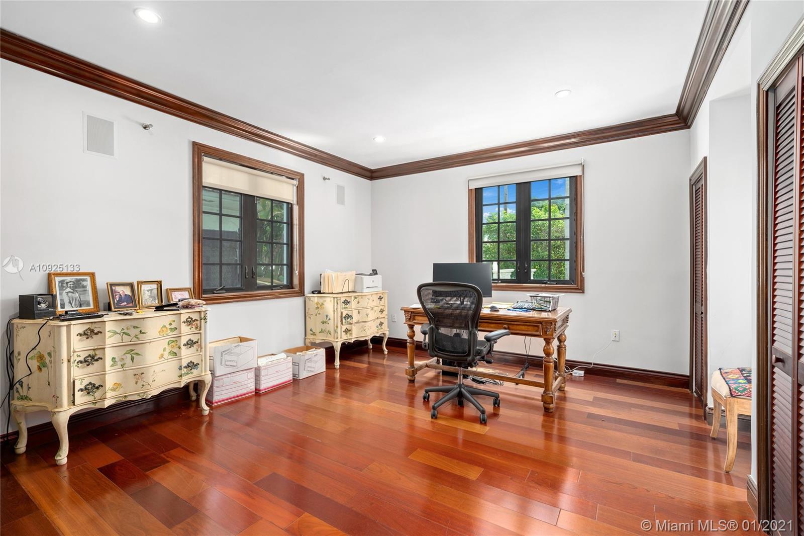 5300 Pine Tree Drive Miami Beach, FL 33140 - Photo 14 of 40 a workspace with furniture hardwood and a window