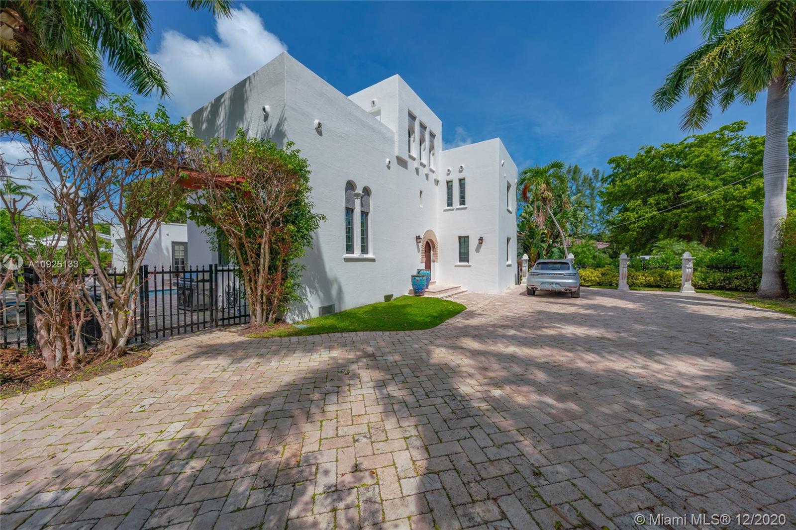 5300 Pine Tree Drive Miami Beach, FL 33140 - Photo 4 of 40 a view of a street with a building in the background