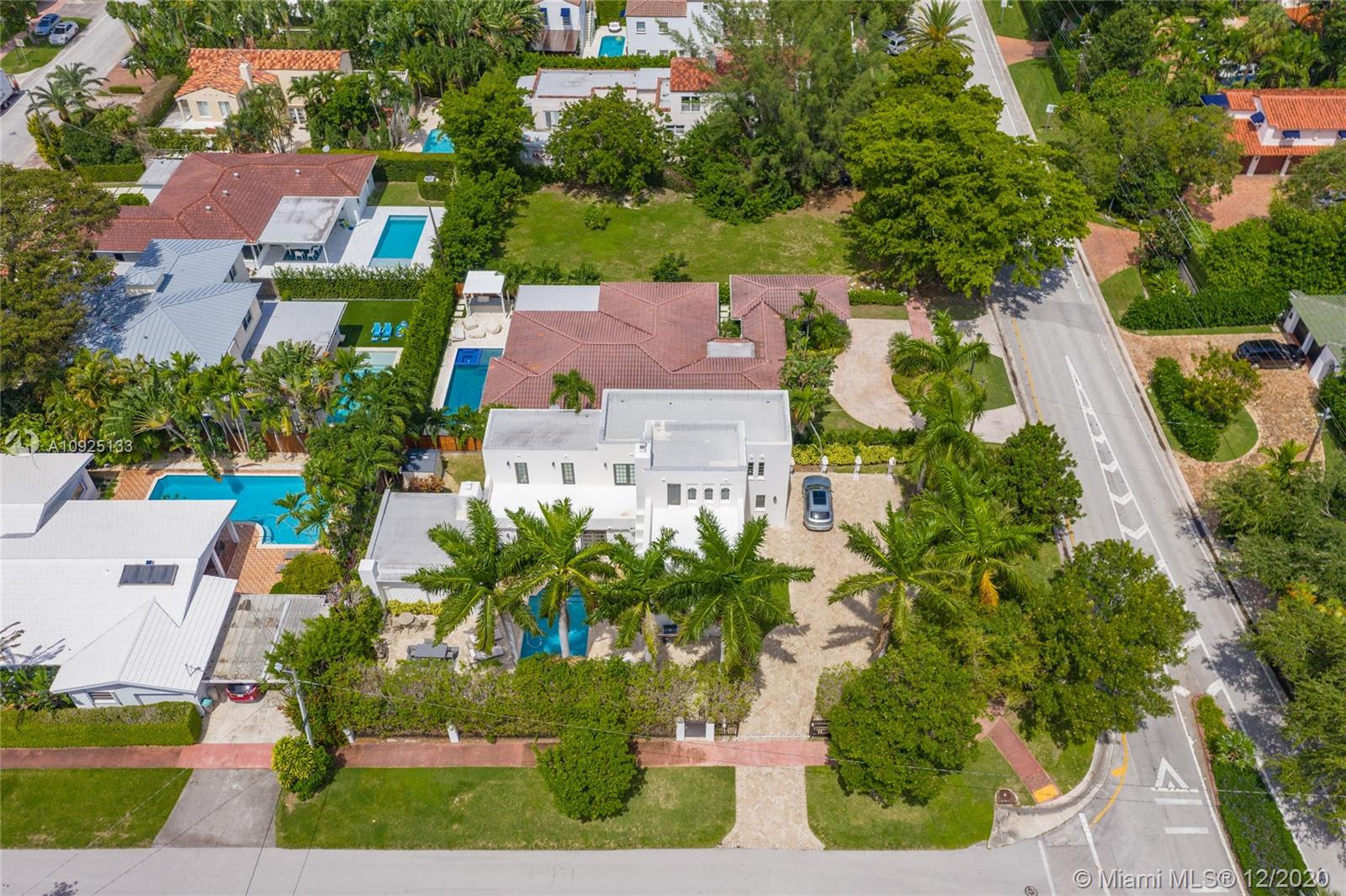 5300 Pine Tree Drive Miami Beach, FL 33140 - Photo 37 of 40 an aerial view of multiple houses with yard