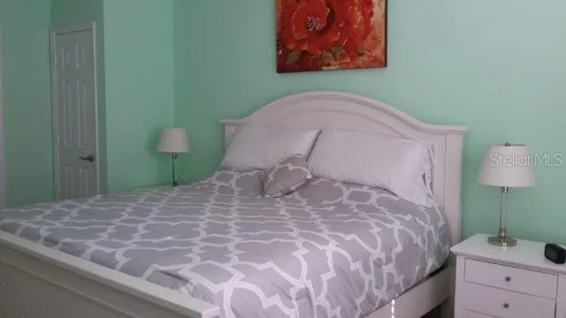 a bathroom with a sink mirror and shower