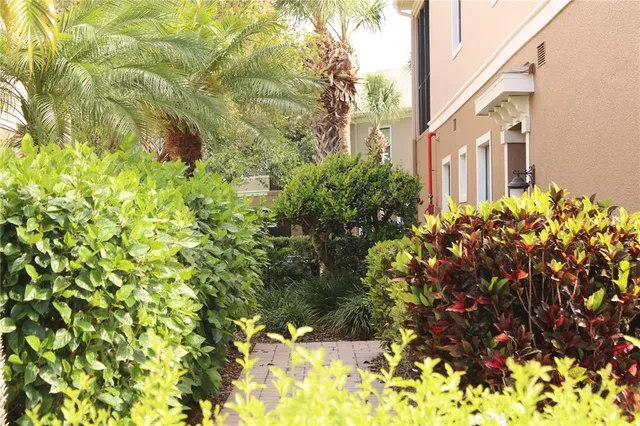 a view of a house with pool and garden