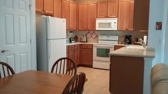 a kitchen with a sink cabinets and window