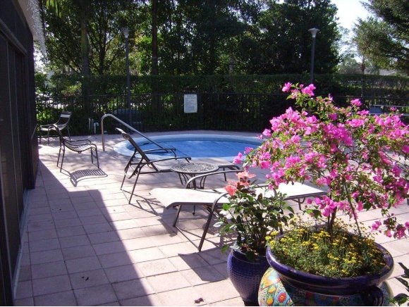 415 Augusta Boulevard, Unit 310 Naples, FL 34113 - Photo 14 of 15 a outdoor view with a seating space