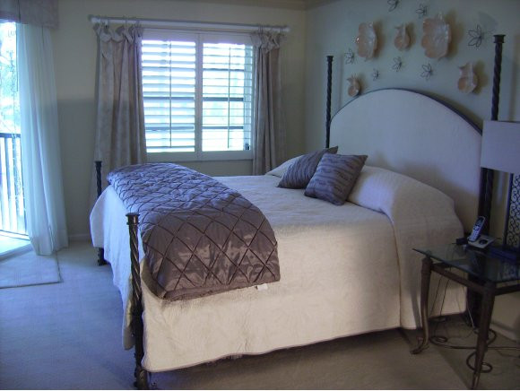 415 Augusta Boulevard, Unit 310 Naples, FL 34113 - Photo 6 of 15 a bedroom with a bed and a window