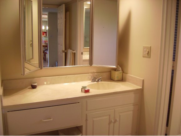 415 Augusta Boulevard, Unit 310 Naples, FL 34113 - Photo 7 of 15 a bathroom with a sink and a mirror
