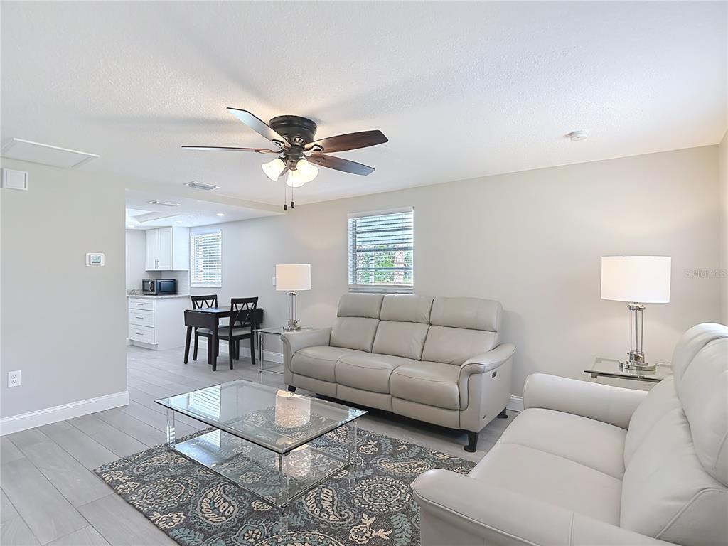 14306 Guava Street Hudson, FL 34667 - Photo 2 of 39 a living room with furniture and a window